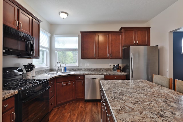 6134 Glade Run Rd, Hilliard, OH 43026 - kitchen featuring black appliances, a sink, dark wood-style floors, and light stone countertops