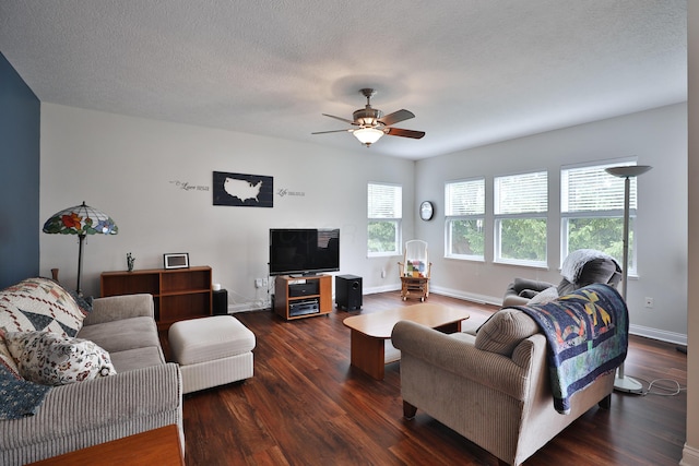 6134 Glade Run Rd, Hilliard, OH 43026 - living area with dark wood-type flooring, ceiling fan, and baseboards