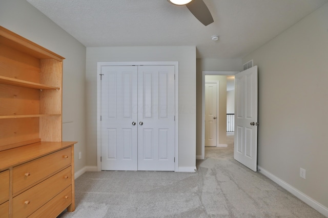 6134 Glade Run Rd, Hilliard, OH 43026 - unfurnished bedroom featuring light colored carpet, a closet, baseboards, and a ceiling fan