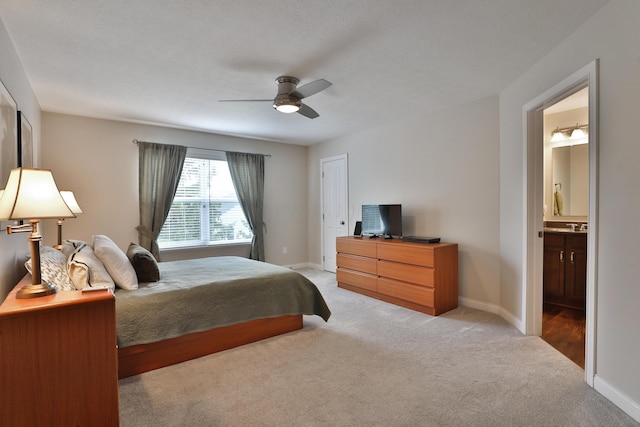 6134 Glade Run Rd, Hilliard, OH 43026 - bedroom featuring light carpet, baseboards, ensuite bath, and a ceiling fan