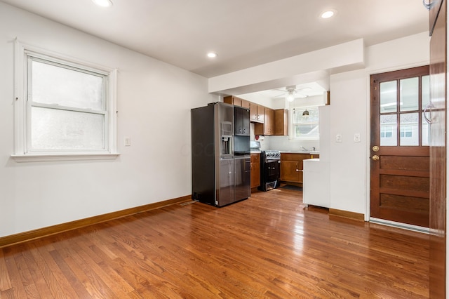 kitchen featuring stainless steel appliances, dark wood-style flooring, baseboards, a ceiling fan, and recessed lighting