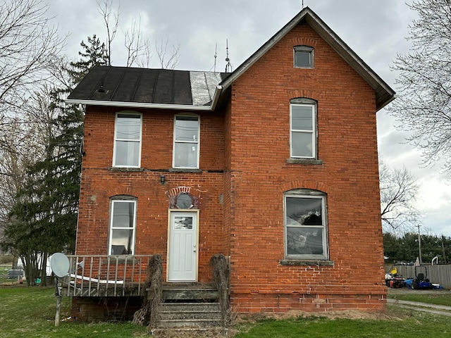 818 S Kibler St, New Washington, OH 44854 - view of front of property featuring a front yard and brick siding