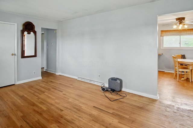 5235 Raiders Rd, Frazeysburg, OH 43822 - spare room with visible vents, baseboards, a ceiling fan, and wood finished floors