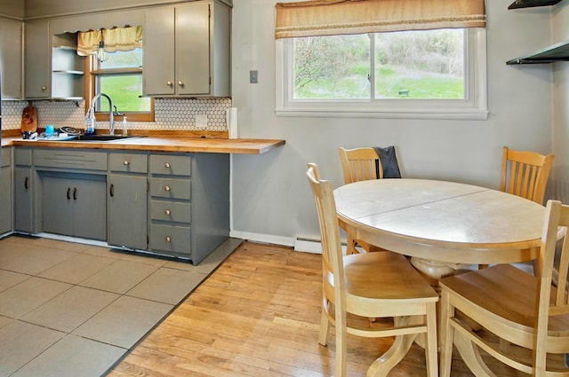 5235 Raiders Rd, Frazeysburg, OH 43822 - kitchen with gray cabinets, decorative backsplash, a sink, and open shelves