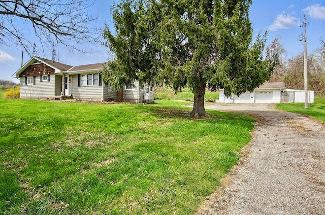 5235 Raiders Rd, Frazeysburg, OH 43822 - view of yard featuring aphalt driveway, a garage, and an outdoor structure
