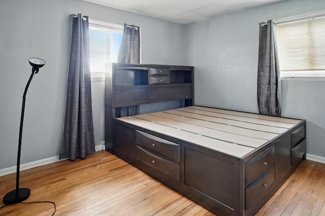 5235 Raiders Rd, Frazeysburg, OH 43822 - bedroom featuring baseboards and light wood-style floors