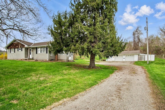 5235 Raiders Rd, Frazeysburg, OH 43822 - exterior space featuring an outbuilding, driveway, and a garage