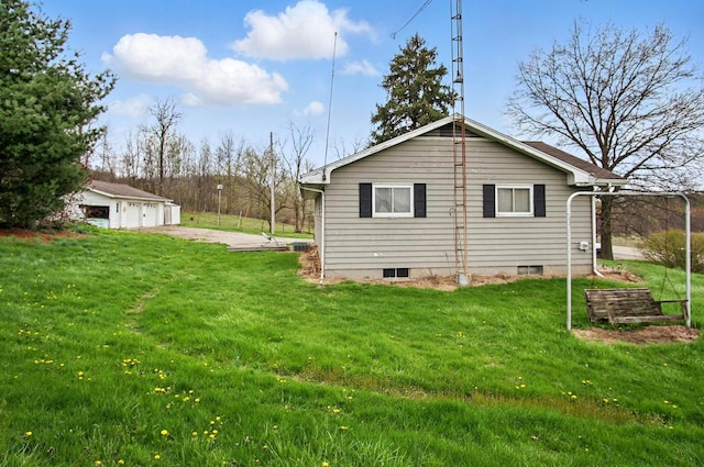 5235 Raiders Rd, Frazeysburg, OH 43822 - view of side of property with crawl space, an outdoor structure, a lawn, and a detached garage