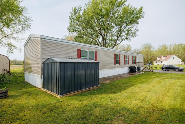 view of home's exterior featuring an outdoor structure, a yard, and a shed