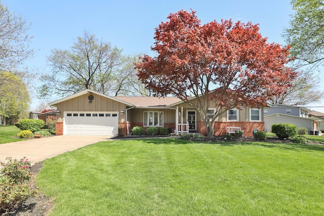 5580 Millington Rd, Columbus, OH 43235 - ranch-style home with a front lawn, board and batten siding, brick siding, and an attached garage