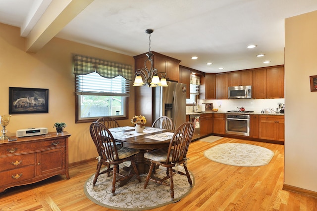 5580 Millington Rd, Columbus, OH 43235 - dining area with recessed lighting, an inviting chandelier, baseboards, and light wood-type flooring