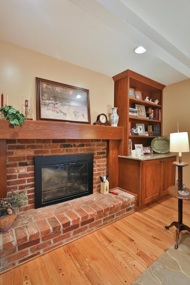 5580 Millington Rd, Columbus, OH 43235 - living area with recessed lighting, light wood-style floors, and a fireplace