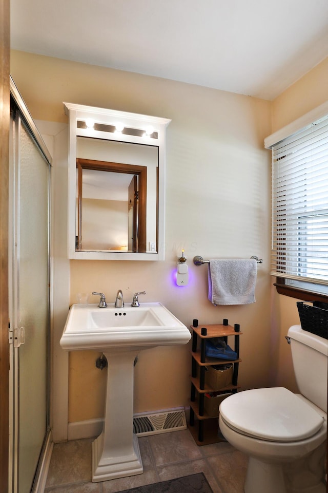 5580 Millington Rd, Columbus, OH 43235 - bathroom with visible vents, a stall shower, and toilet