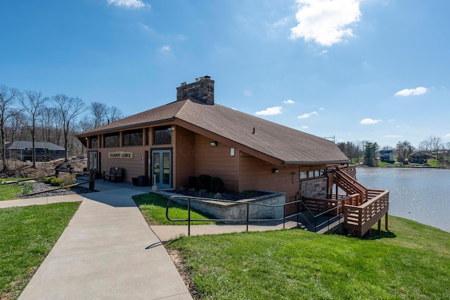 211 Candlewood Dr Unit 9, Mount Gilead, OH 43338 - view of side of property with a chimney, a water view, a yard, and stairs