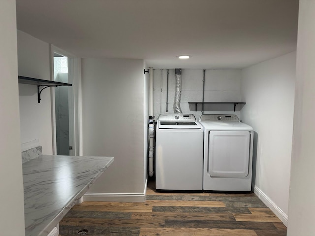 4620 Boynton Pl, Columbus, OH 43227 - laundry area with dark wood finished floors, baseboards, laundry area, and washer and clothes dryer