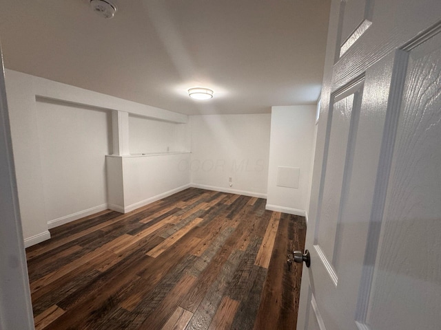 4620 Boynton Pl, Columbus, OH 43227 - finished below grade area featuring dark wood-type flooring and baseboards