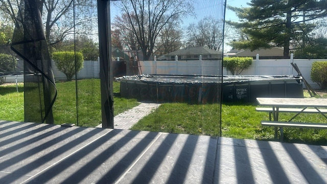 4620 Boynton Pl, Columbus, OH 43227 - exterior space featuring a fenced backyard, a pool, a trampoline, and a lawn