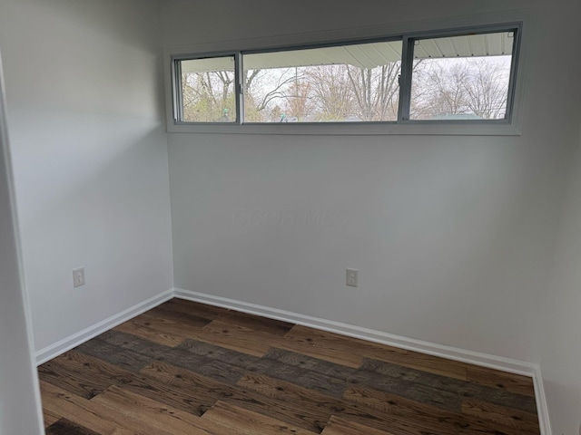 4620 Boynton Pl, Columbus, OH 43227 - empty room featuring baseboards and dark wood-style flooring