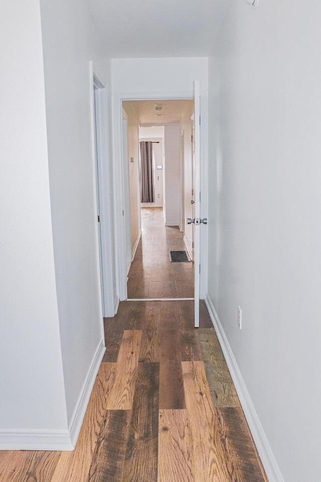 4620 Boynton Pl, Columbus, OH 43227 - corridor with baseboards and wood finished floors