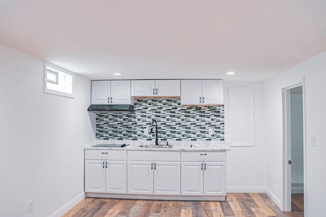 4620 Boynton Pl, Columbus, OH 43227 - interior space with backsplash, baseboards, white cabinetry, and a sink
