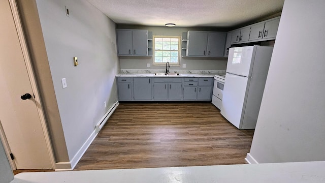 kitchen with open shelves, a sink, white appliances, gray cabinetry, and a baseboard heating unit
