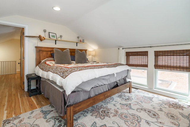 bedroom with recessed lighting, light wood finished floors, and lofted ceiling