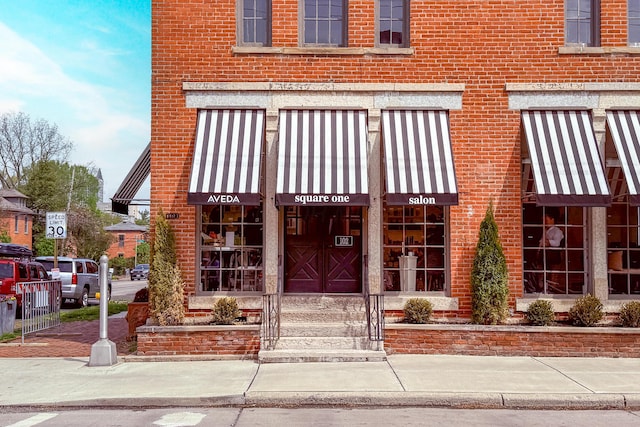 entrance to property with brick siding