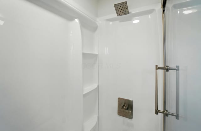 bathroom with a shower stall