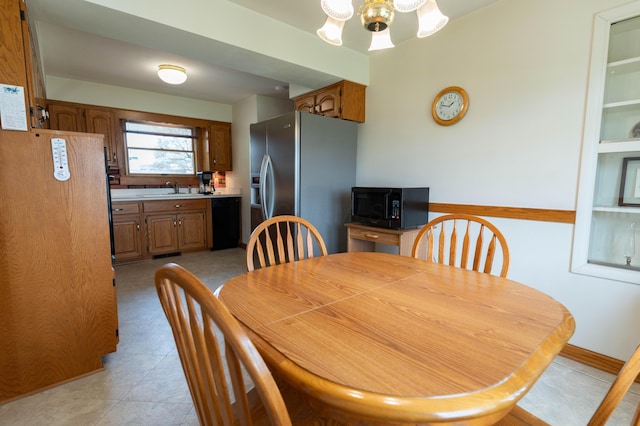 dining space featuring baseboards and a ceiling fan