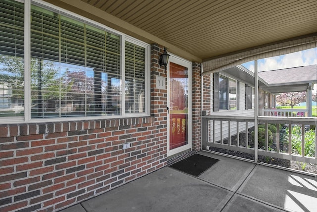 entrance to property with brick siding