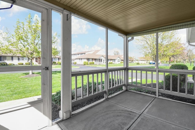 unfurnished sunroom with a residential view