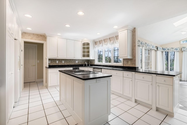 1354 Hemlock Ct NE, Lancaster, OH 43130 - kitchen featuring dark countertops, decorative backsplash, light tile patterned flooring, glass insert cabinets, and a peninsula