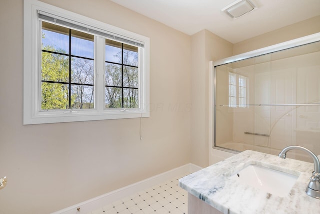 1354 Hemlock Ct NE, Lancaster, OH 43130 - bathroom featuring tile patterned floors, combined bath / shower with glass door, visible vents, vanity, and baseboards