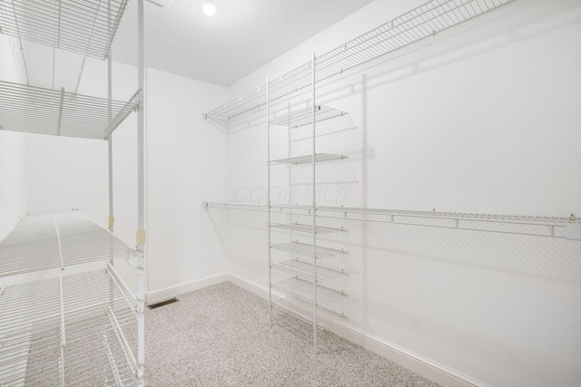 1354 Hemlock Ct NE, Lancaster, OH 43130 - walk in closet featuring visible vents and carpet floors