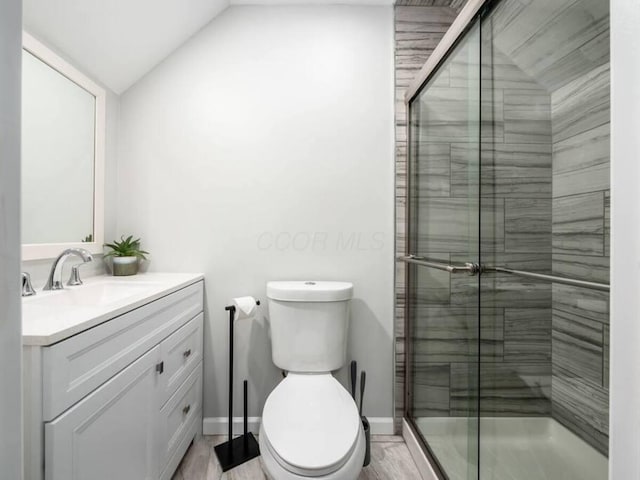 85 Dana Ave, Columbus, OH 43222 - bathroom with toilet, lofted ceiling, wood finished floors, a shower stall, and vanity