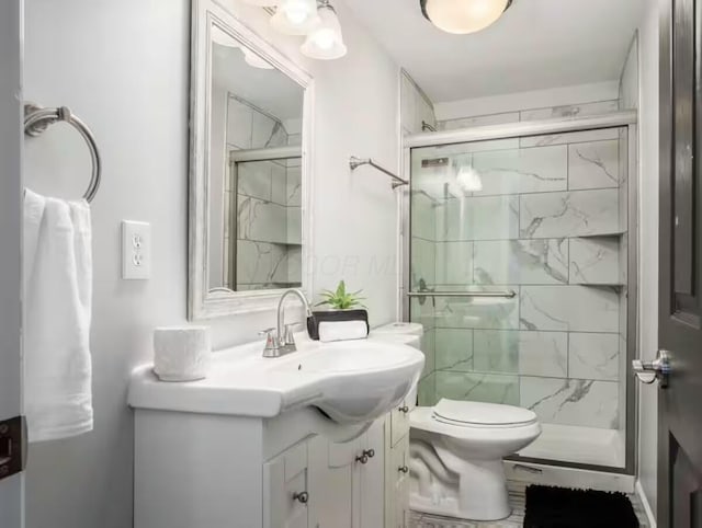 85 Dana Ave, Columbus, OH 43222 - bathroom featuring vanity, toilet, and a stall shower