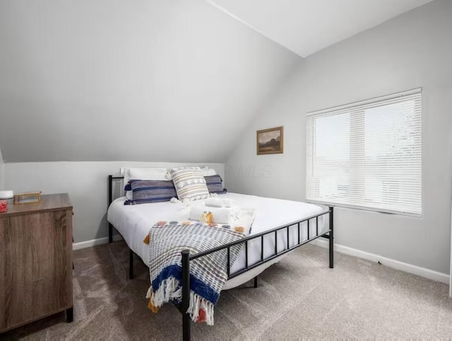85 Dana Ave, Columbus, OH 43222 - bedroom with lofted ceiling, carpet floors, and baseboards