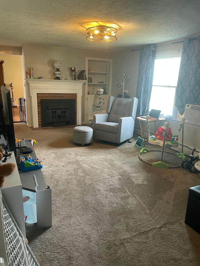 carpeted living room featuring a brick fireplace and a textured ceiling