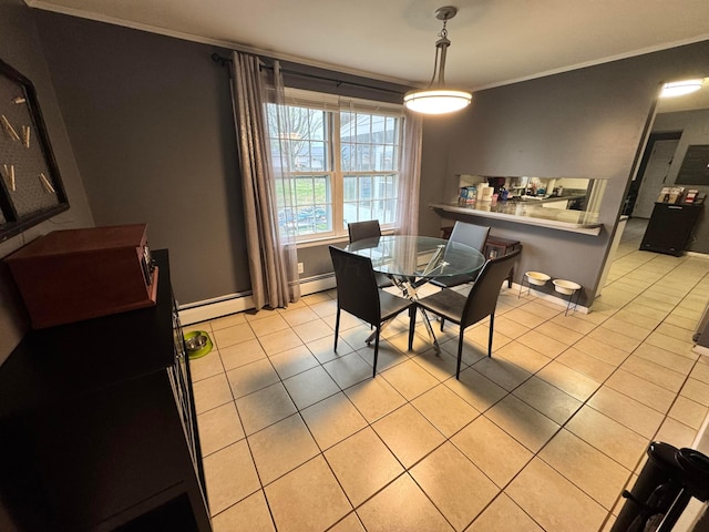 751 Vicksburg Dr, Mansfield, OH 44904 - dining space with crown molding, light tile patterned floors, a baseboard radiator, and baseboards