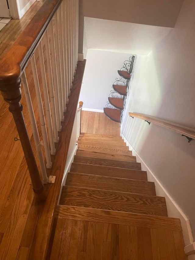 751 Vicksburg Dr, Mansfield, OH 44904 - stairway with wood finished floors and baseboards
