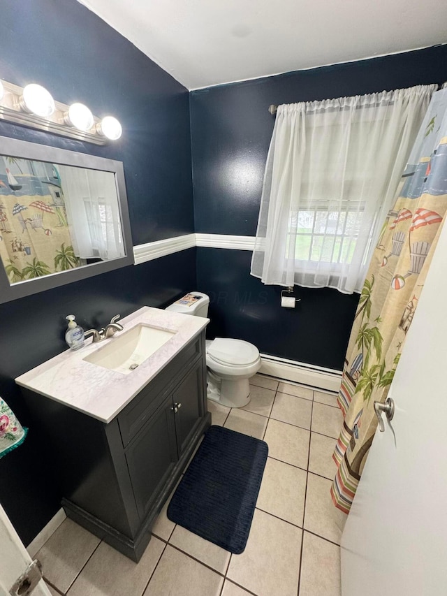 751 Vicksburg Dr, Mansfield, OH 44904 - bathroom featuring a baseboard heating unit, tile patterned floors, vanity, toilet, and baseboards