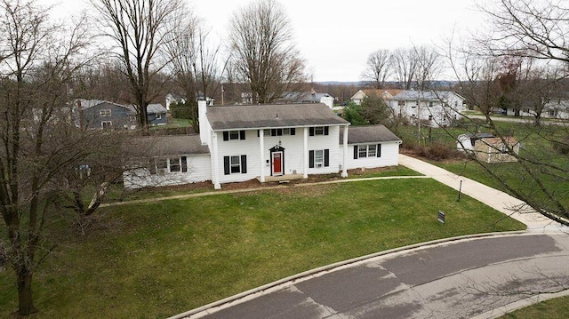 751 Vicksburg Dr, Mansfield, OH 44904 - view of front of home with a chimney, a front yard, a residential view, and roof with shingles