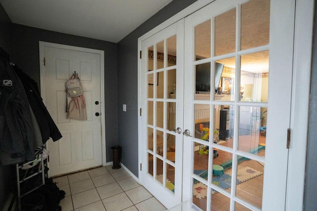 751 Vicksburg Dr, Mansfield, OH 44904 - entryway featuring french doors and light tile patterned flooring