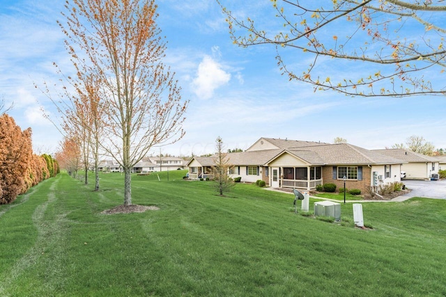 view of yard with a sunroom