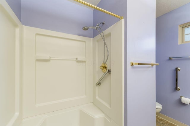 full bath with baseboards, toilet, and a shower