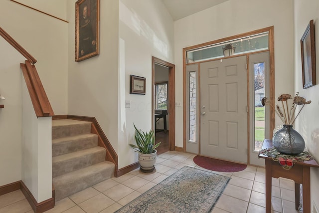 665 Cherrington Rd, Westerville, OH 43081 - entrance foyer with stairway, baseboards, and light tile patterned floors