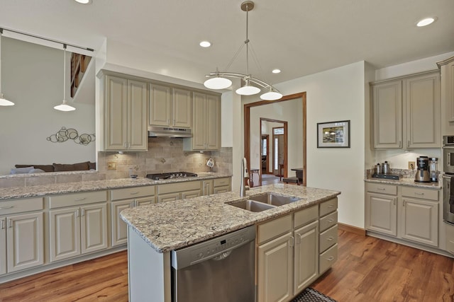 665 Cherrington Rd, Westerville, OH 43081 - kitchen with under cabinet range hood, light wood finished floors, stainless steel appliances, and a sink