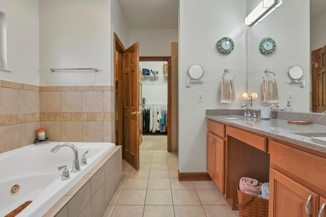 665 Cherrington Rd, Westerville, OH 43081 - full bathroom featuring double vanity, a bath, tile patterned floors, and a sink