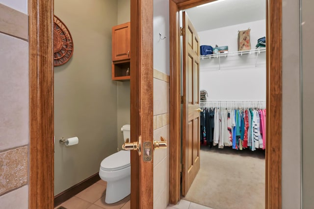 665 Cherrington Rd, Westerville, OH 43081 - bathroom with tile patterned flooring, a spacious closet, and toilet