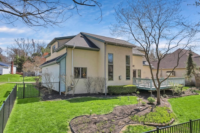 665 Cherrington Rd, Westerville, OH 43081 - back of house with stucco siding, a lawn, a fenced backyard, and a deck